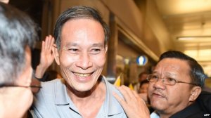 Mr Hai (C) was mobbed by supporters upon arriving in Los Angeles