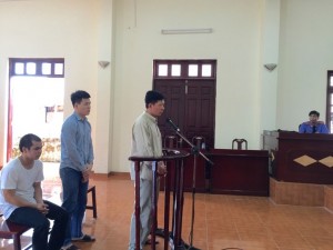 Thugs Bang (in front) and Tong in courtroom