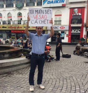 Environmentalist La Viet Dung in Hanoi's center in the morning of May 29, 2016 before being detained by local security agents