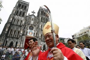 Newly-appointed Catholic Archbishop of Hanoi Pierre Nguyen Van Nhon waves to believers in front of St. Joseph Cathedral after Pentecost Sunday mass in Hanoi in this May 23, 2010 file photo. Pope Francis on January 4, 2015 named 20 new cardinals, or top officials of the Roman Catholic Church hierarchy around the world. One of them is Pierre Nguyen. REUTERS/Kham/Files  (VIETNAM - Tags: RELIGION) )